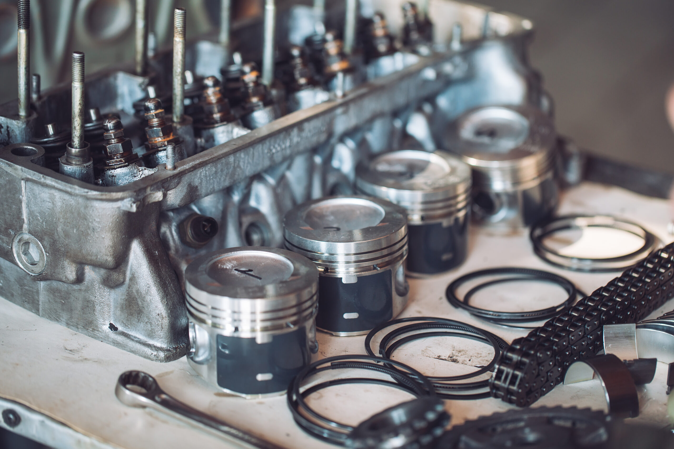 Disassembled car engine. Pistons, rings, crankshaft.